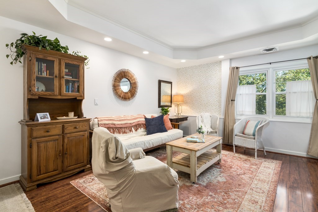 26 School Street, Unit 211 Hull, MA 02045 - Photo 12 of 19 a living room with furniture a rug and white walls