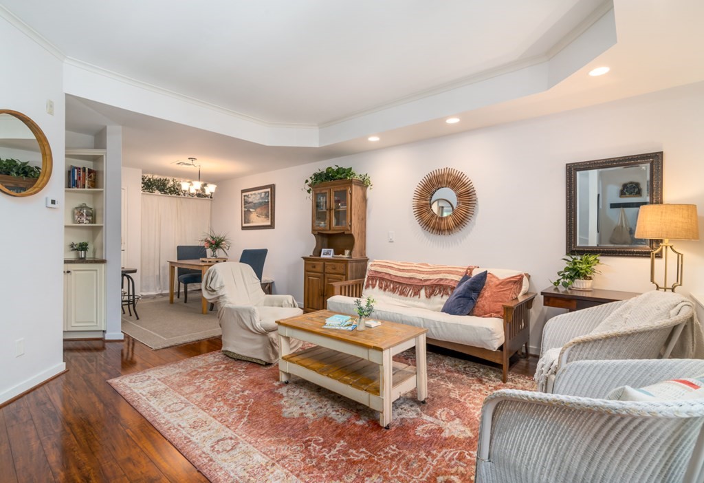 26 School Street, Unit 211 Hull, MA 02045 - Photo 14 of 19 a living room with furniture and wooden floor