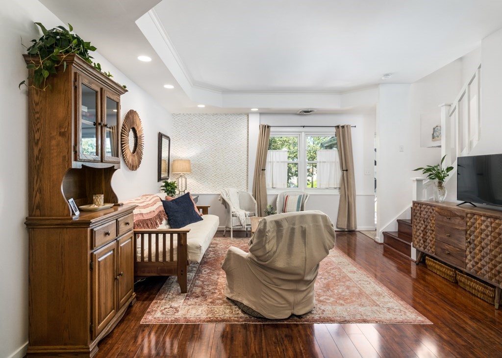 26 School Street, Unit 211 Hull, MA 02045 - Photo 15 of 19 a living room with furniture and a window