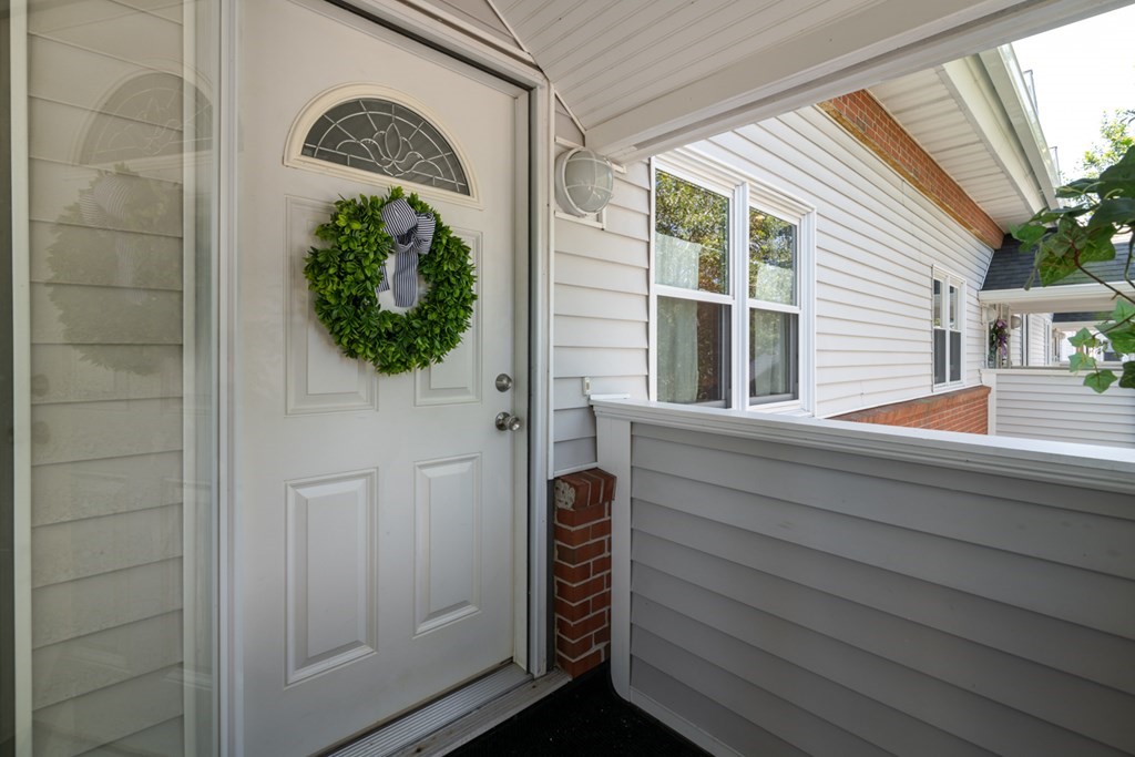 26 School Street, Unit 211 Hull, MA 02045 - Photo 2 of 19 a view of a door and a window
