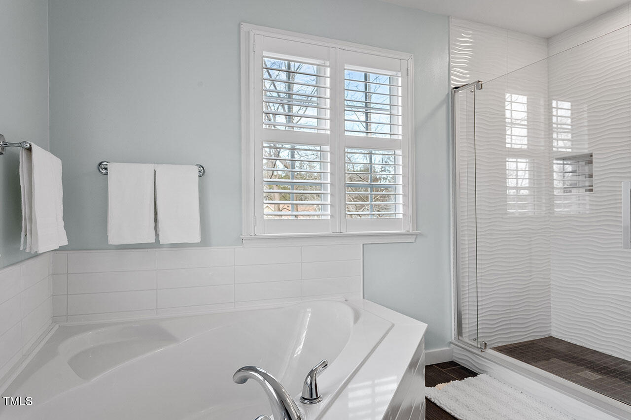 5 Spring Water Lane Durham, NC 27712 - Photo 20 of 32 a bathroom with a bathtub and shower