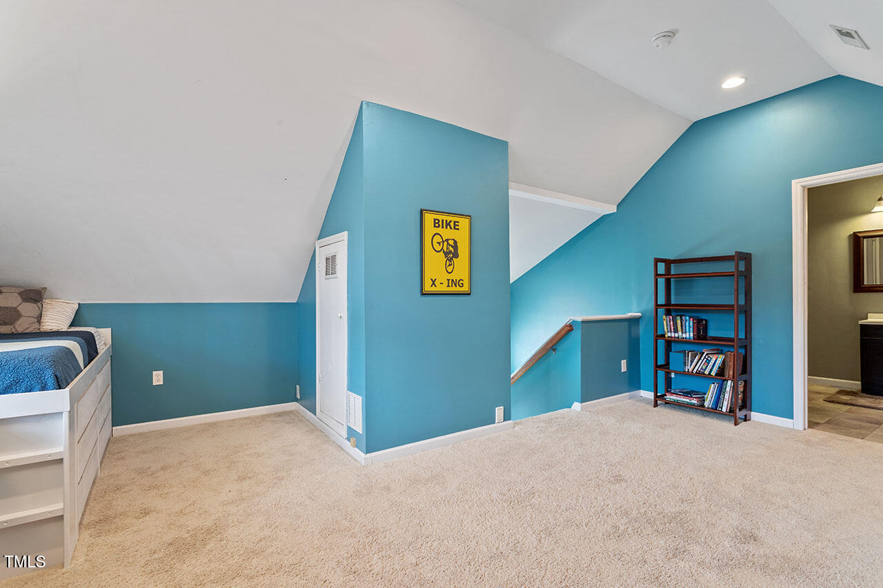 5 Spring Water Lane Durham, NC 27712 - Photo 25 of 32 a bedroom with a bed and a television