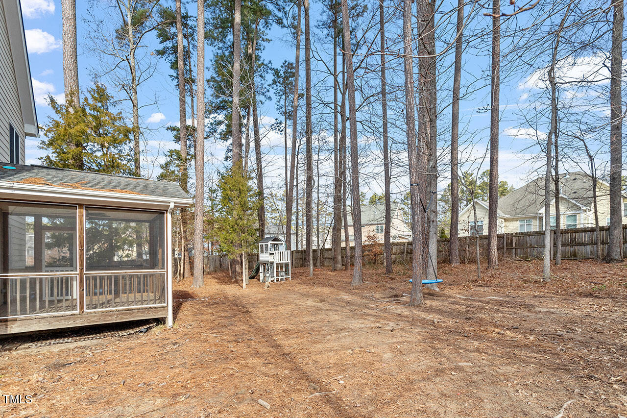 5 Spring Water Lane Durham, NC 27712 - Photo 30 of 32 a view of outdoor space with deck and trees
