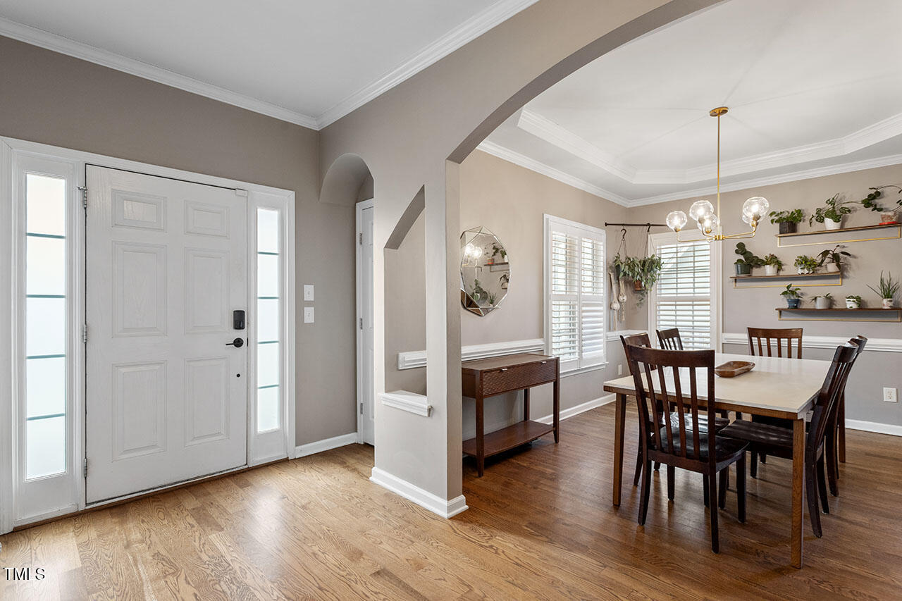 5 Spring Water Lane Durham, NC 27712 - Photo 4 of 32 a view of a dining room with furniture window and wooden floor