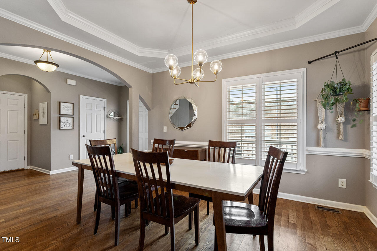 5 Spring Water Lane Durham, NC 27712 - Photo 6 of 32 a view of a dining room with furniture window and wooden floor