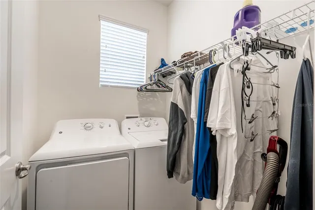 a utility room with dryer and washer