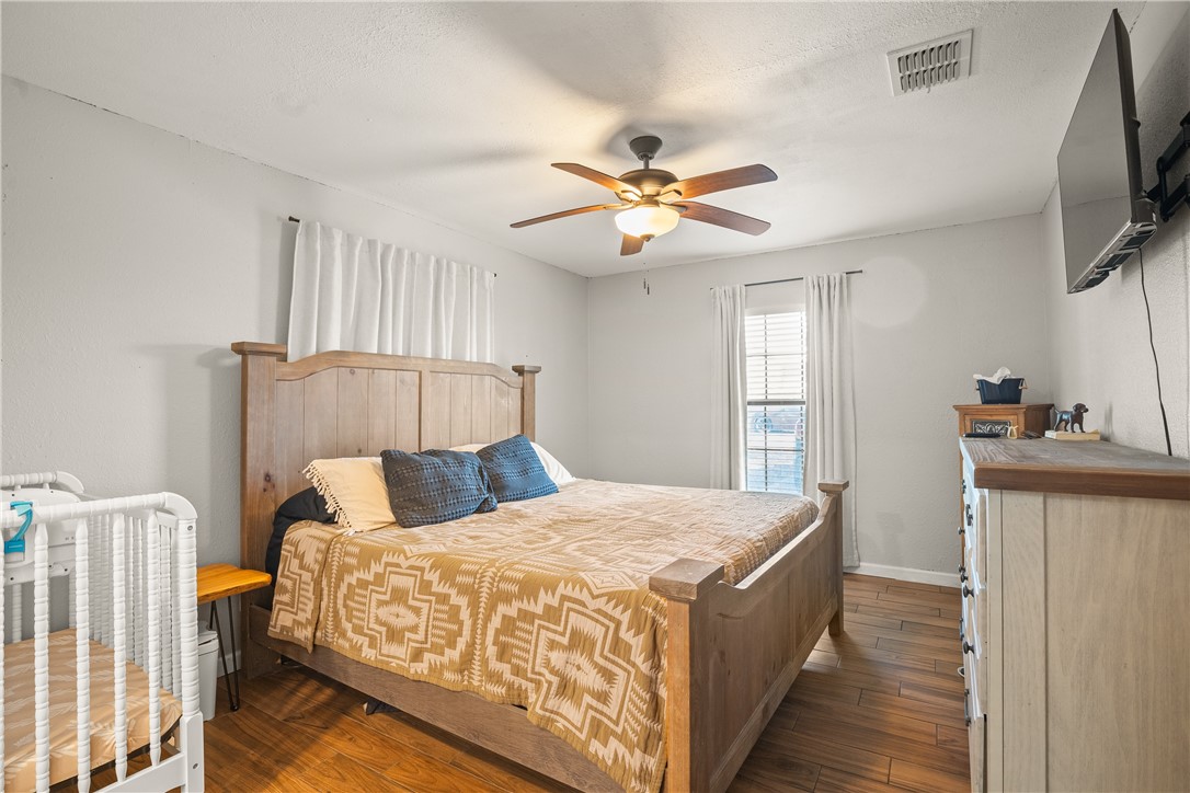 167 Trail Ridge Drive Sandia, TX 78383 - Photo 14 of 33 a bedroom with a bed and a flat screen tv