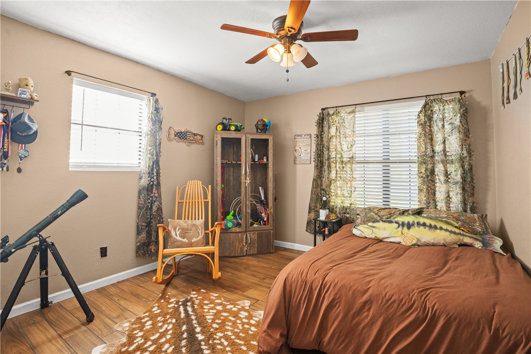 167 Trail Ridge Drive Sandia, TX 78383 - Photo 20 of 33 a bed sitting in a bedroom next to a window
