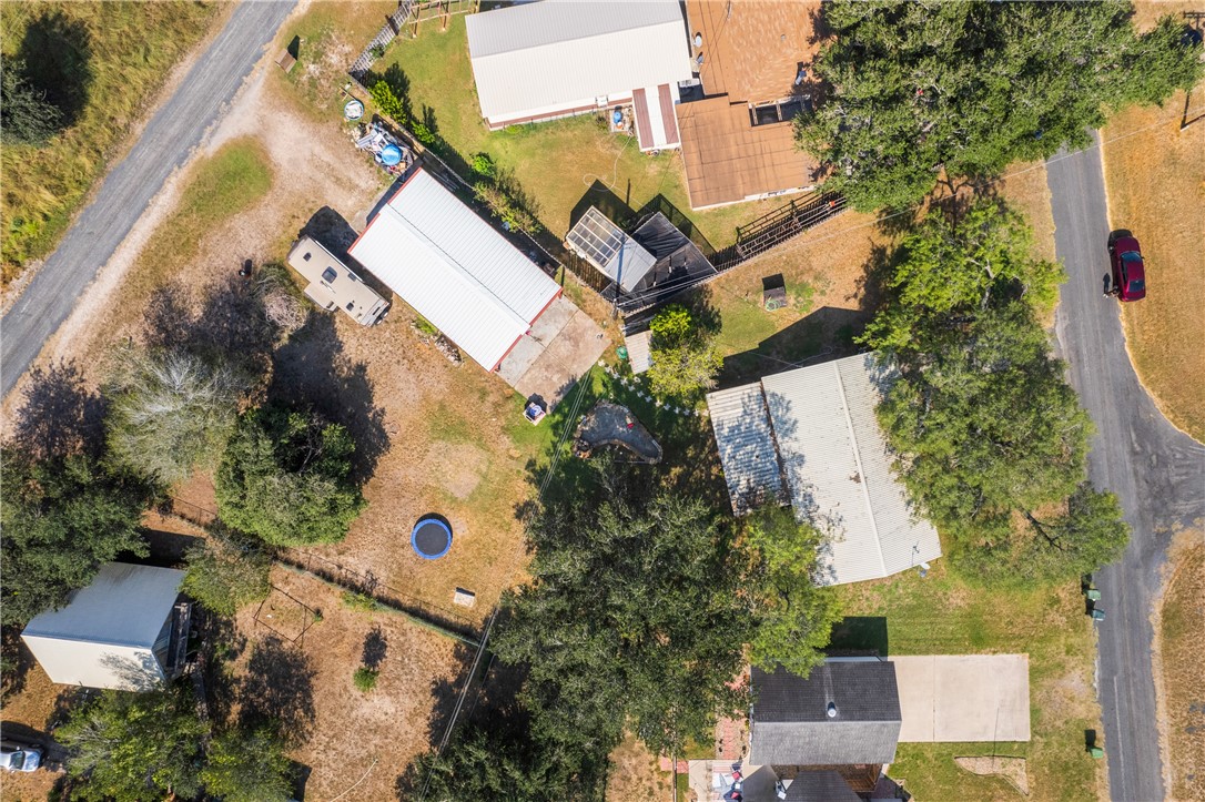 167 Trail Ridge Drive Sandia, TX 78383 - Photo 2 of 33 an aerial view of a house with a yard and garden