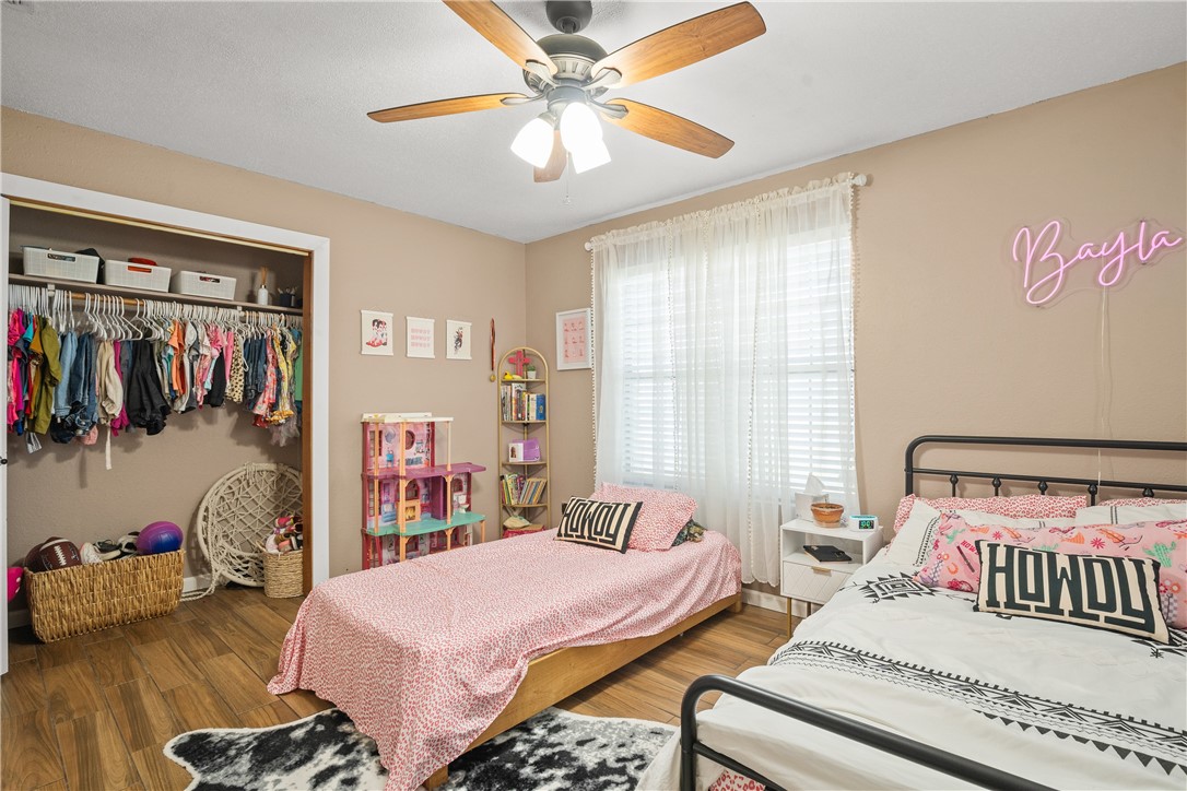 167 Trail Ridge Drive Sandia, TX 78383 - Photo 23 of 33 a bedroom with bed and a walk in closet