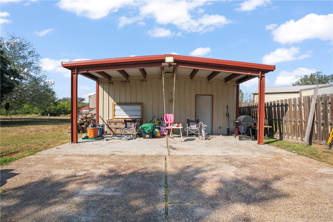 167 Trail Ridge Drive Sandia, TX 78383 - Photo 26 of 33 a view of a chairs and table in the patio next to a yard