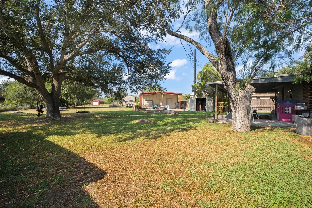 167 Trail Ridge Drive Sandia, TX 78383 - Photo 30 of 33 a view of a tree in front of a house