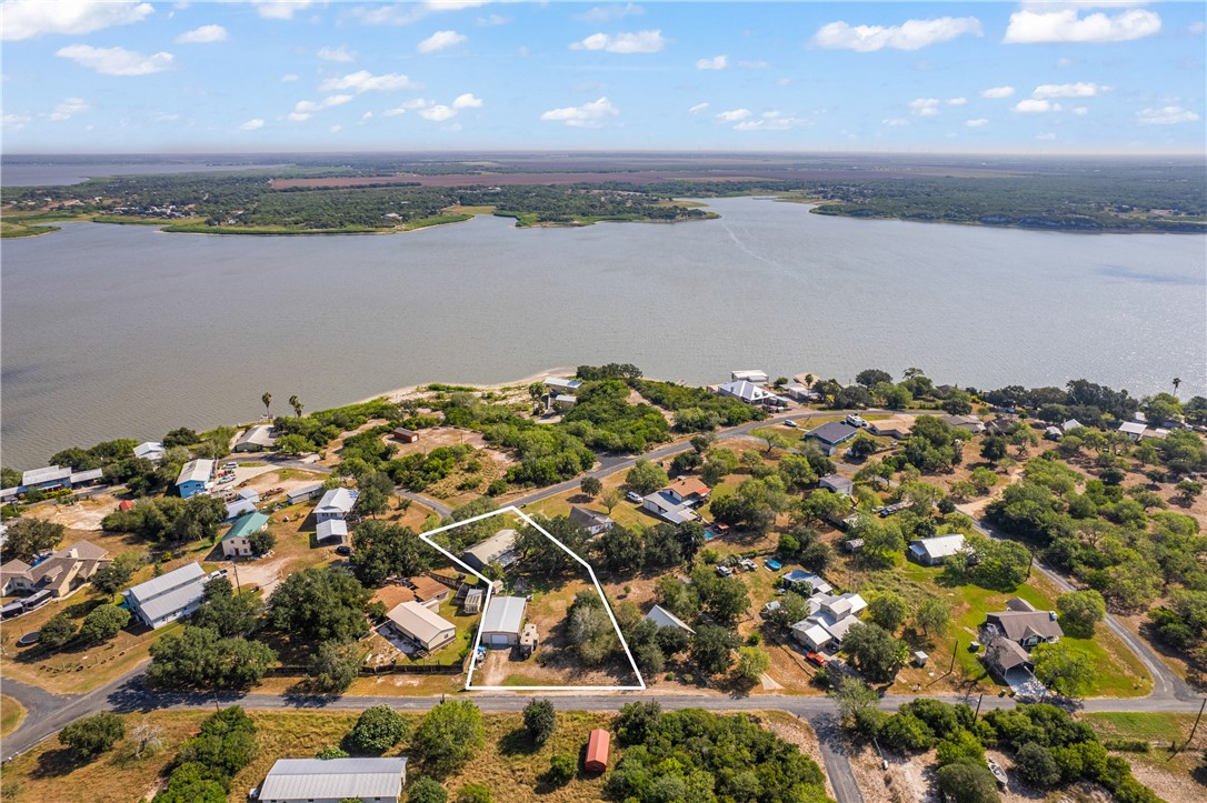 167 Trail Ridge Drive Sandia, TX 78383 - Photo 31 of 33 an aerial view of a residential houses with lake view