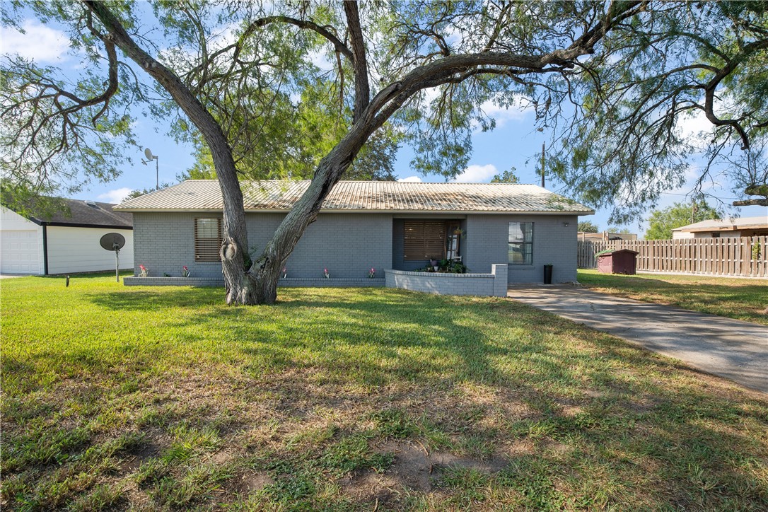 167 Trail Ridge Drive Sandia, TX 78383 - Photo 5 of 33 a front view of a house with a garden
