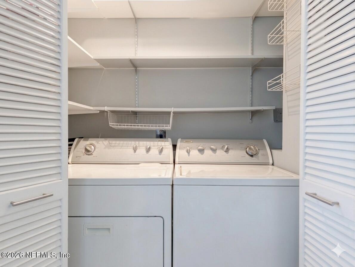 11654 Lake Ride Drive Jacksonville, FL 32223 - Photo 19 of 36 a close up view of a washer and dryer