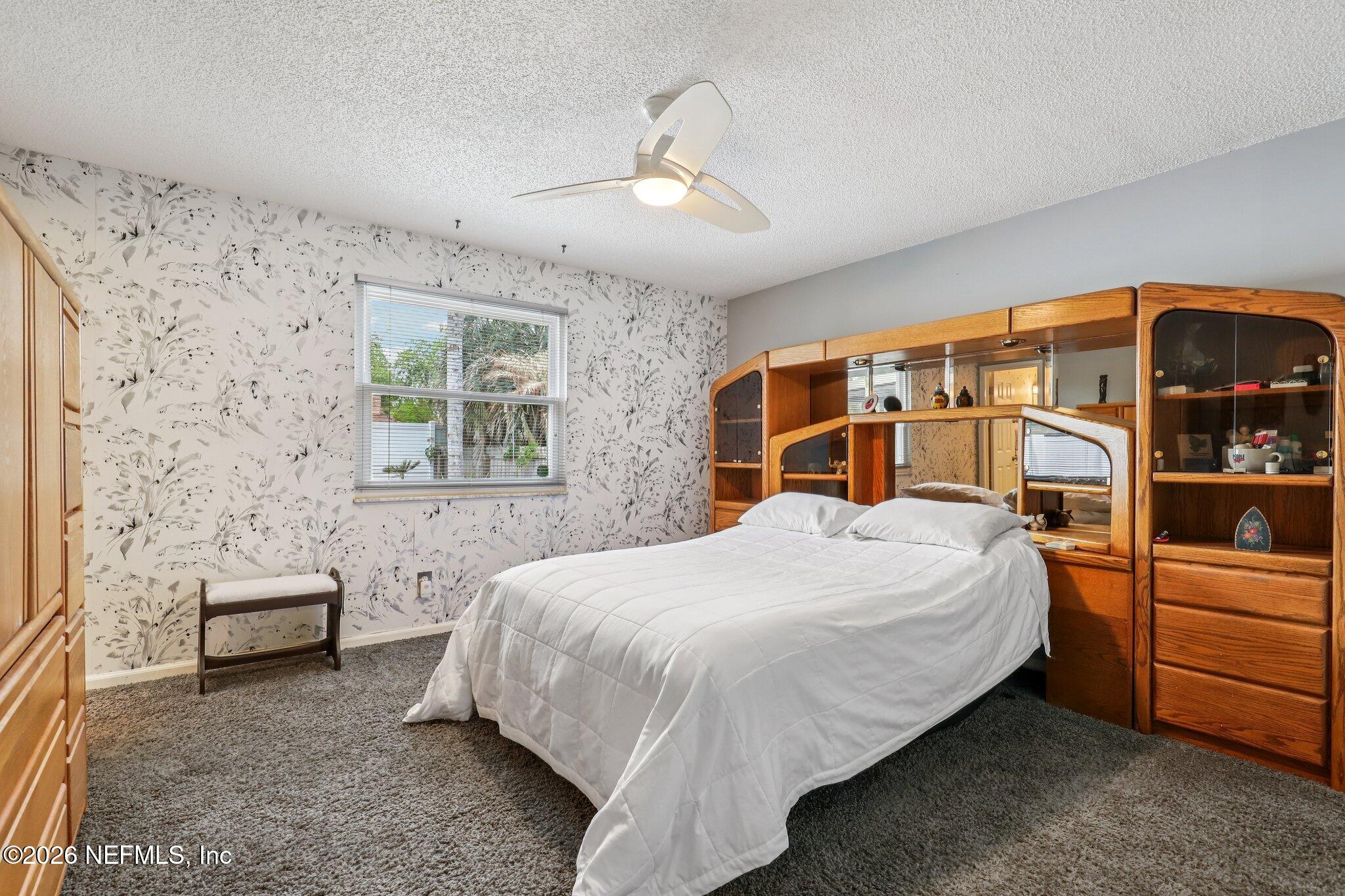 11654 Lake Ride Drive Jacksonville, FL 32223 - Photo 20 of 36 a bedroom with a bed and a dresser