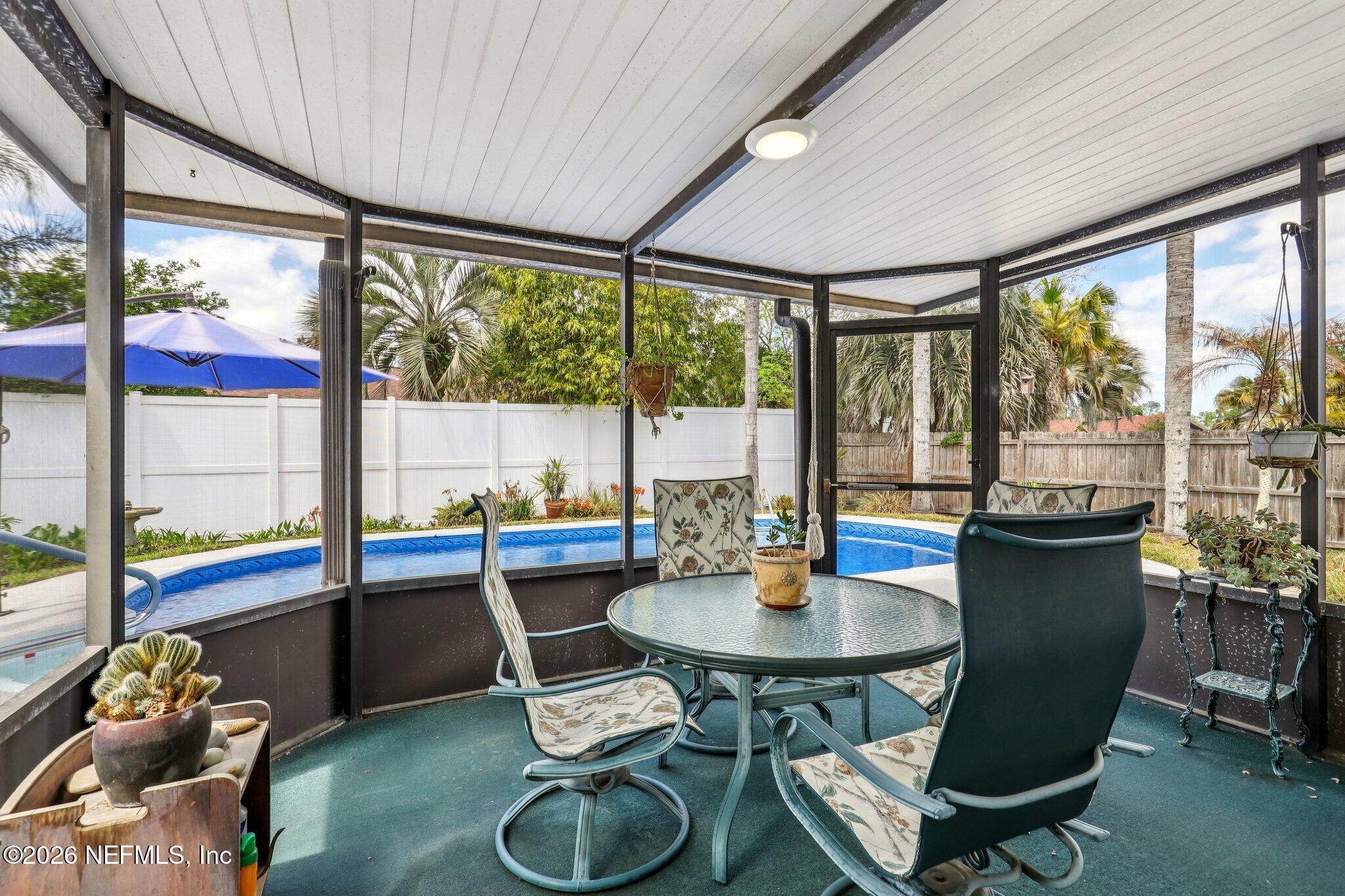 11654 Lake Ride Drive Jacksonville, FL 32223 - Photo 29 of 36 a view of a dining room with furniture window and outside view