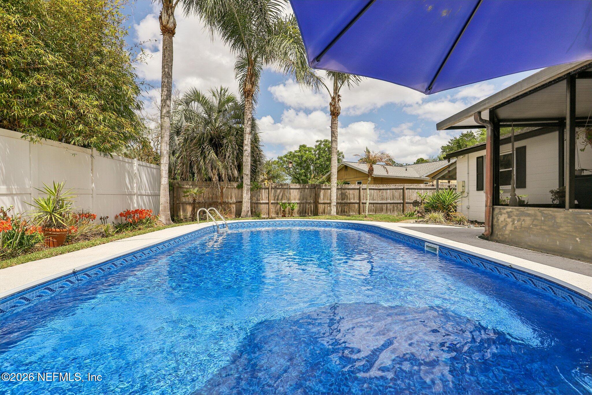 11654 Lake Ride Drive Jacksonville, FL 32223 - Photo 32 of 36 a view of outdoor space with swimming pool and furniture