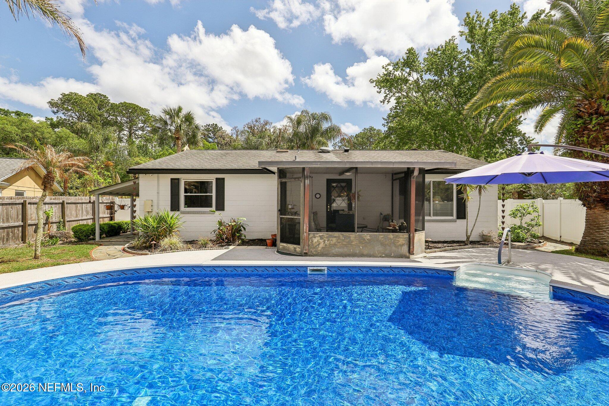 11654 Lake Ride Drive Jacksonville, FL 32223 - Photo 33 of 36 a front view of house with yard and green space