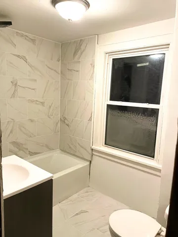 a bathroom with a toilet and a sink