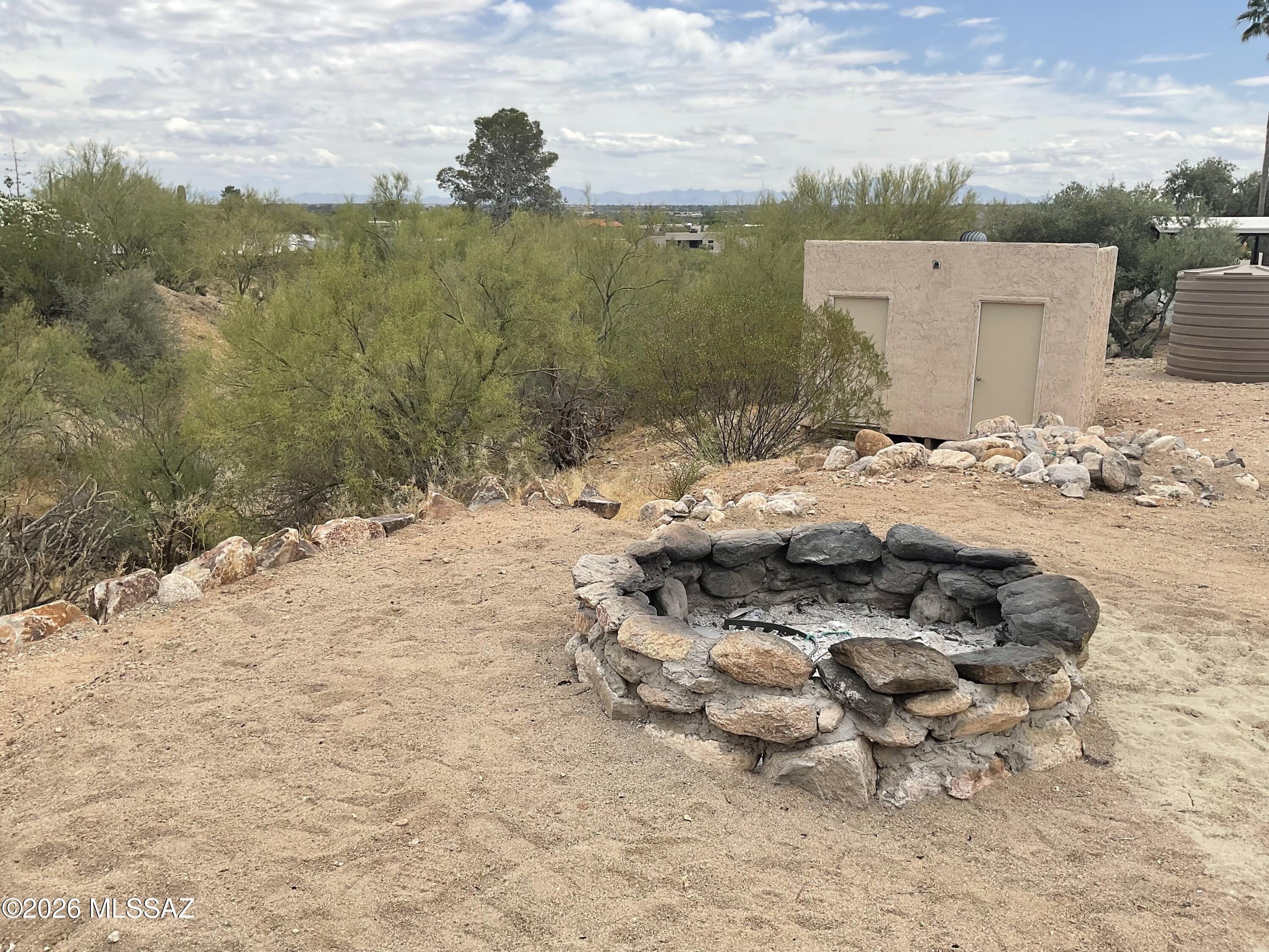 4060 North Swan Road Tucson, AZ 85718 - Photo 39 of 47 a view of a dry yard with wooden fence