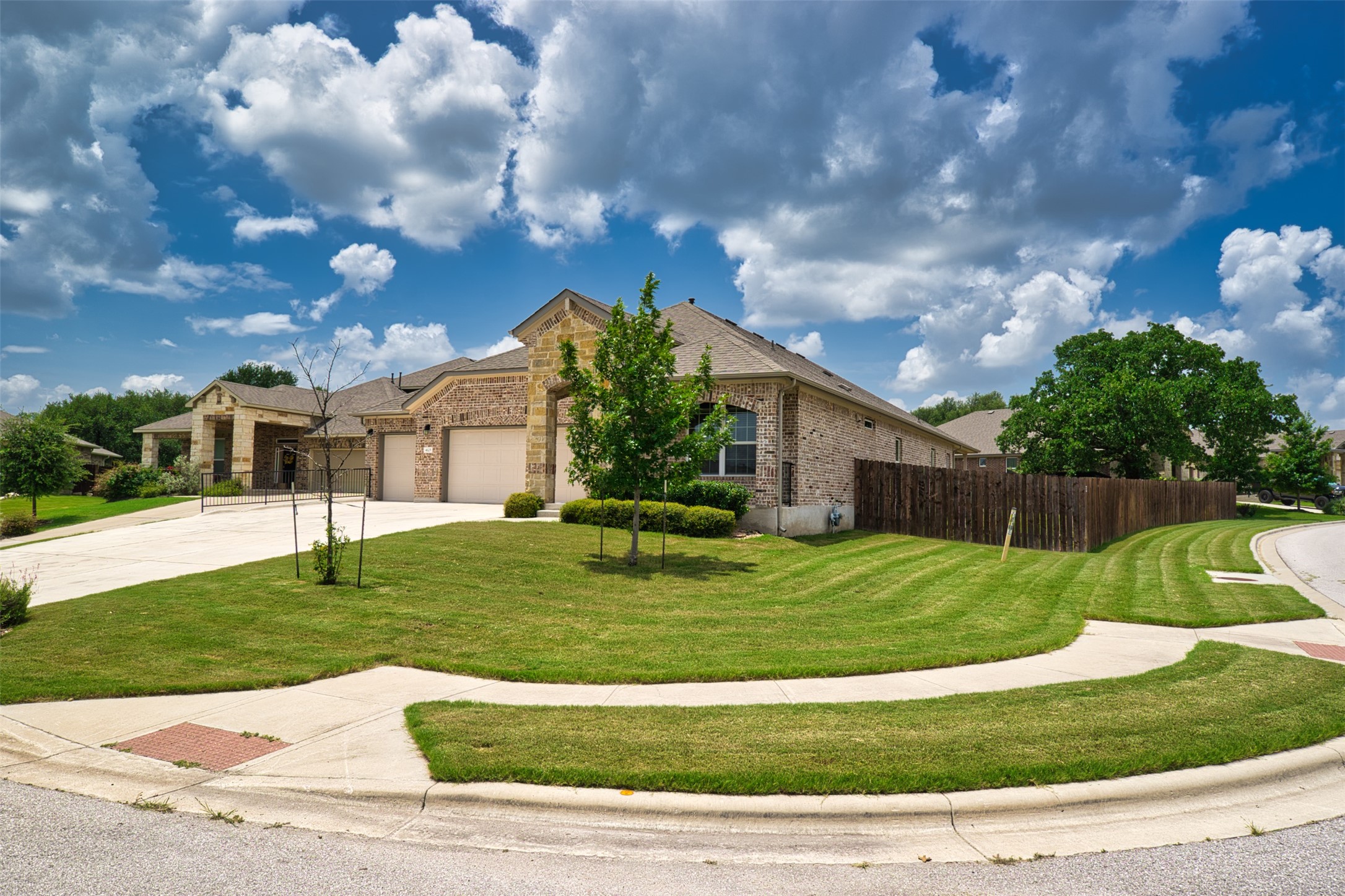 4125 Buffalo Ford Road Georgetown, TX 78628 - Photo 1 of 28 View of front facade featuring a garage, driveway, and brick siding