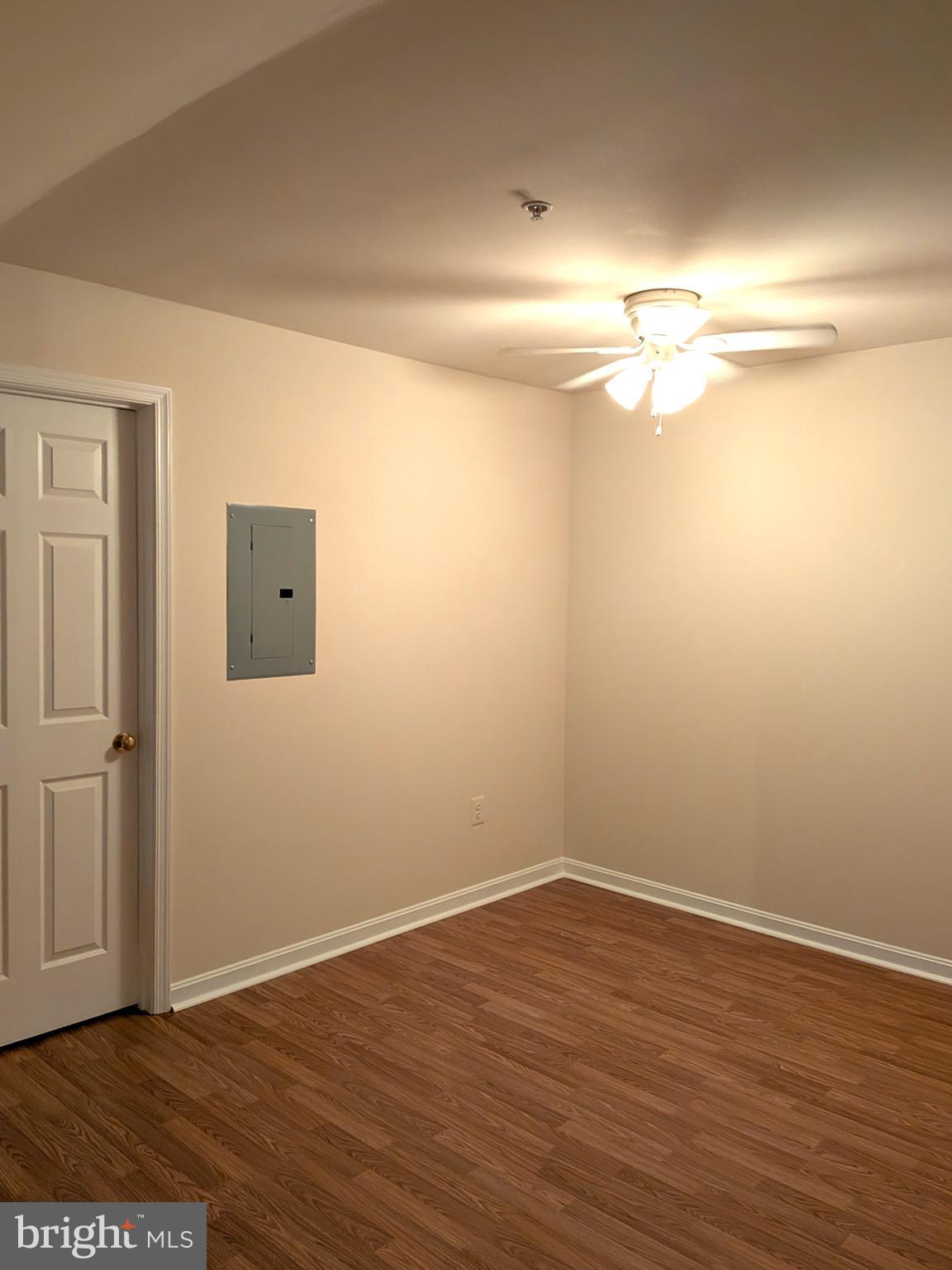 109 Timberbrook Lane, Unit 301 Gaithersburg, MD 20878 - Photo 19 of 22 a view of a room with wooden floor