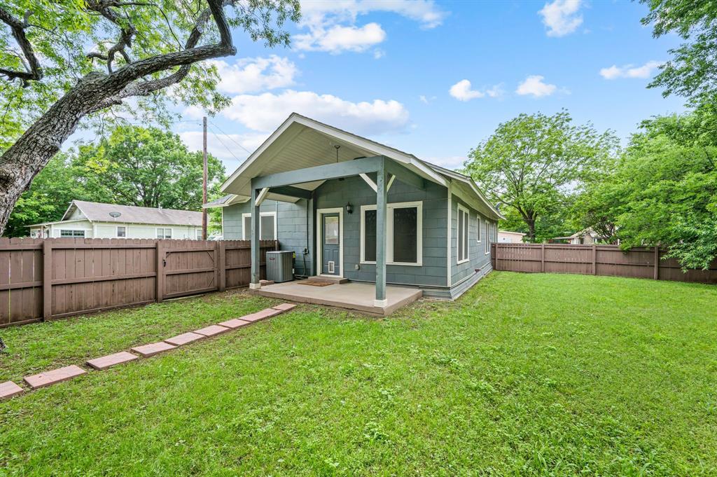 800 North Clements Street Gainesville, TX 76240 - Photo 23 of 27 a view of a house with a yard and sitting area
