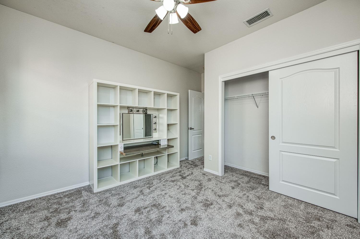 3991 Harlan Ranch Boulevard Clovis, CA 93619 - Photo 11 of 21 an empty room with closet and windows