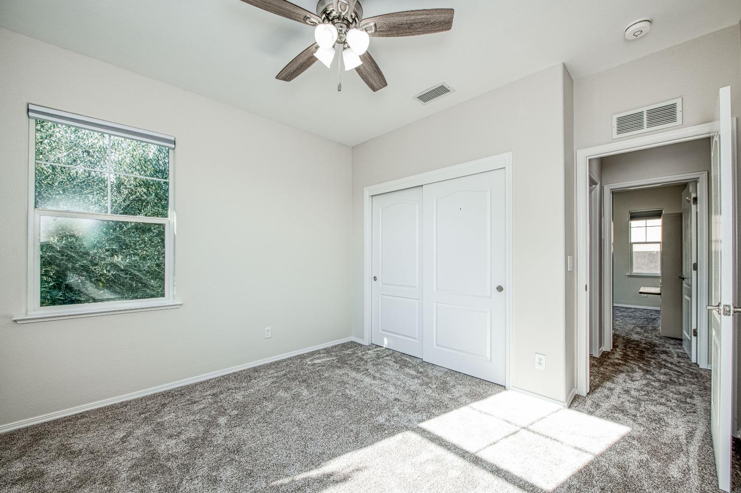3991 Harlan Ranch Boulevard Clovis, CA 93619 - Photo 9 of 21 a view of an empty room and window