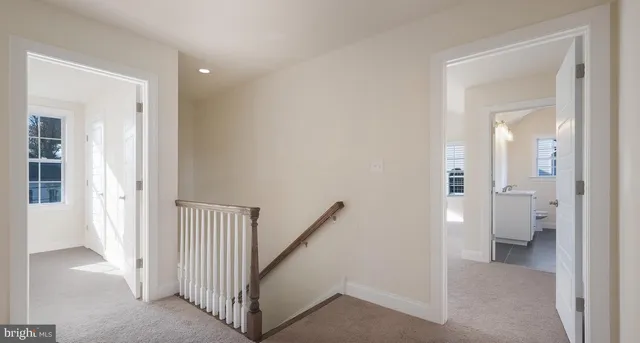 a view of a bathroom from a hallway