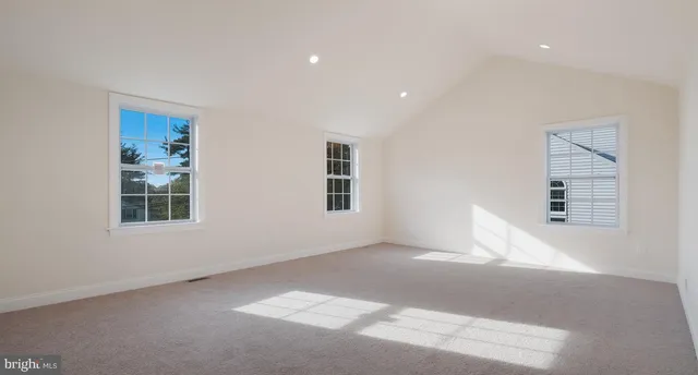 a view of empty room with windows