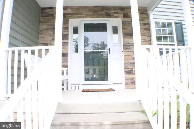 a view of a building with a window and brick walls
