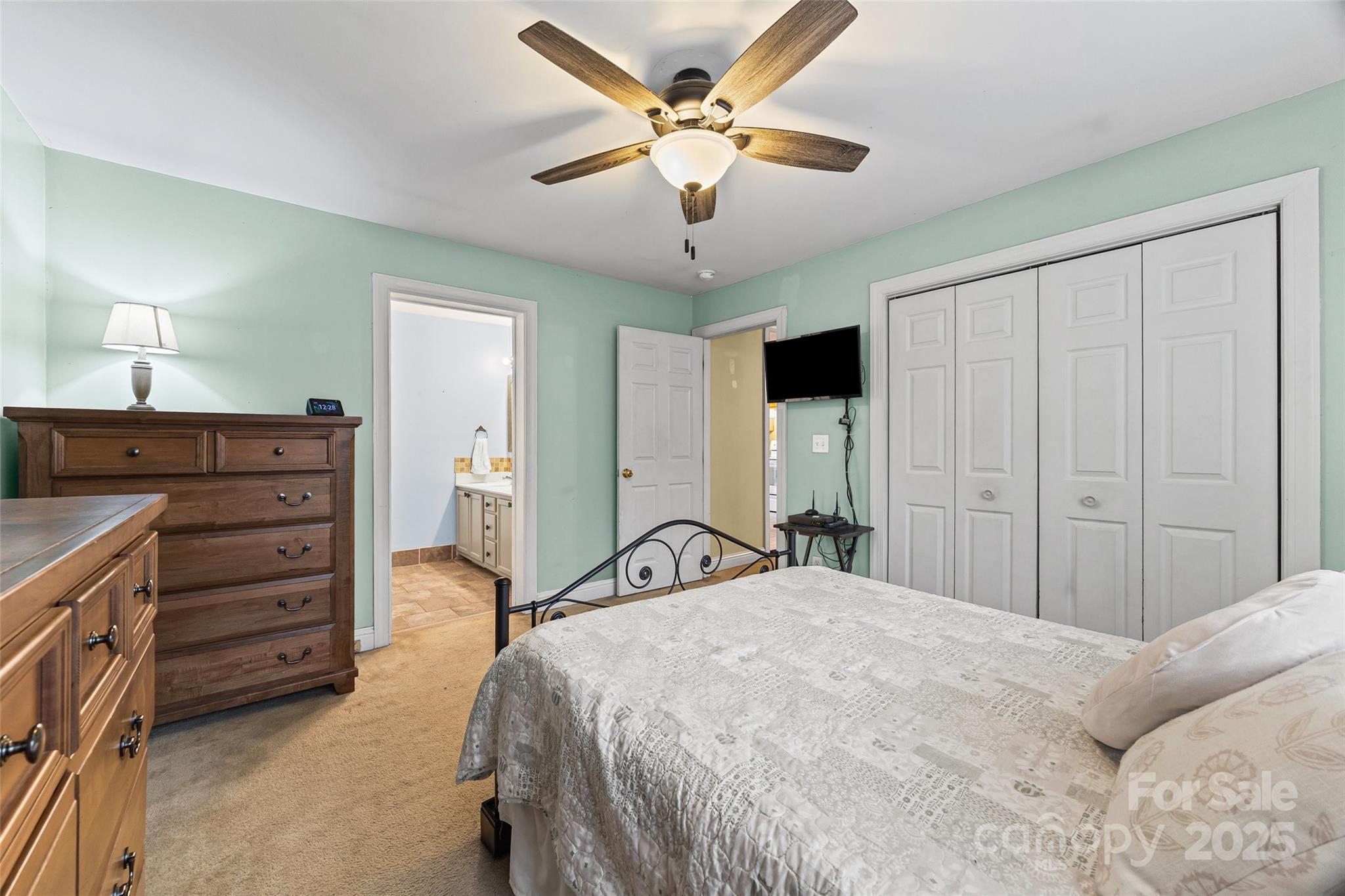 332 Sutton Spring Road York, SC 29745 - Photo 11 of 21 a bedroom with a bed and a chandelier