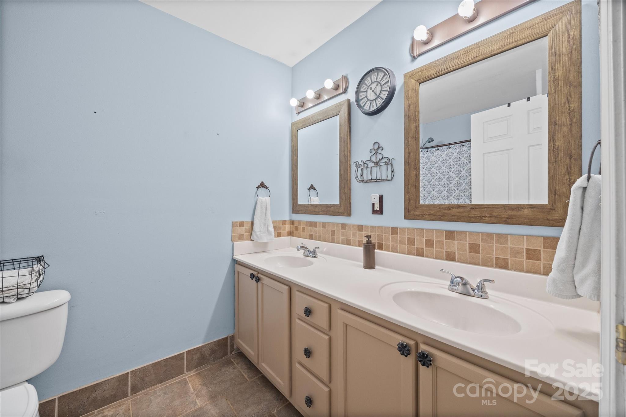 332 Sutton Spring Road York, SC 29745 - Photo 12 of 21 a bathroom with a sink and a mirror