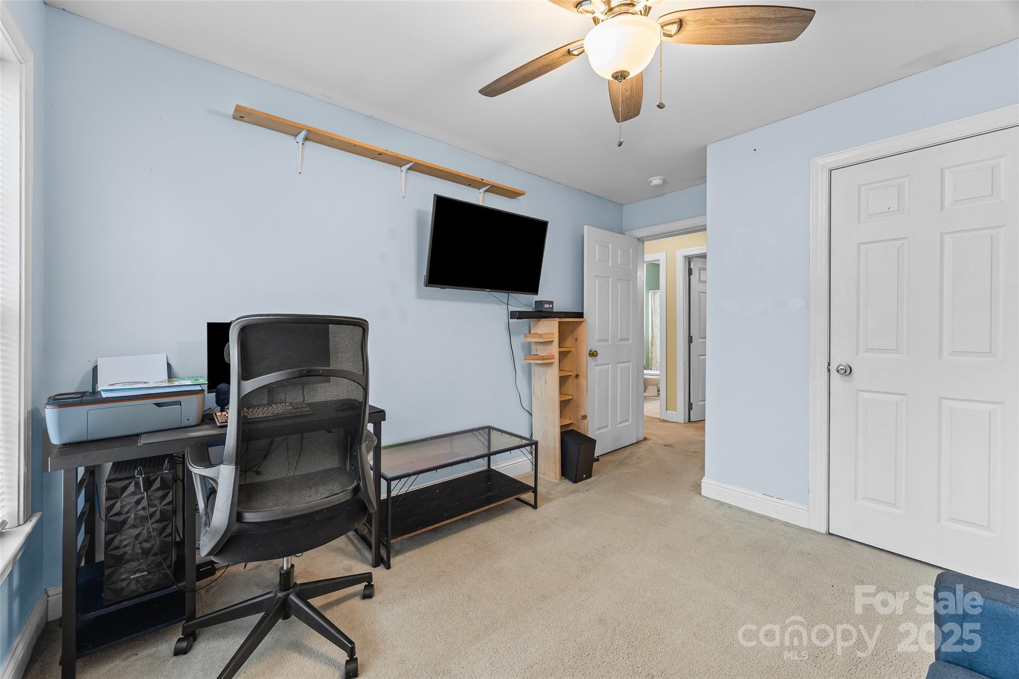 332 Sutton Spring Road York, SC 29745 - Photo 14 of 21 a livingroom with a chair and a flat screen tv