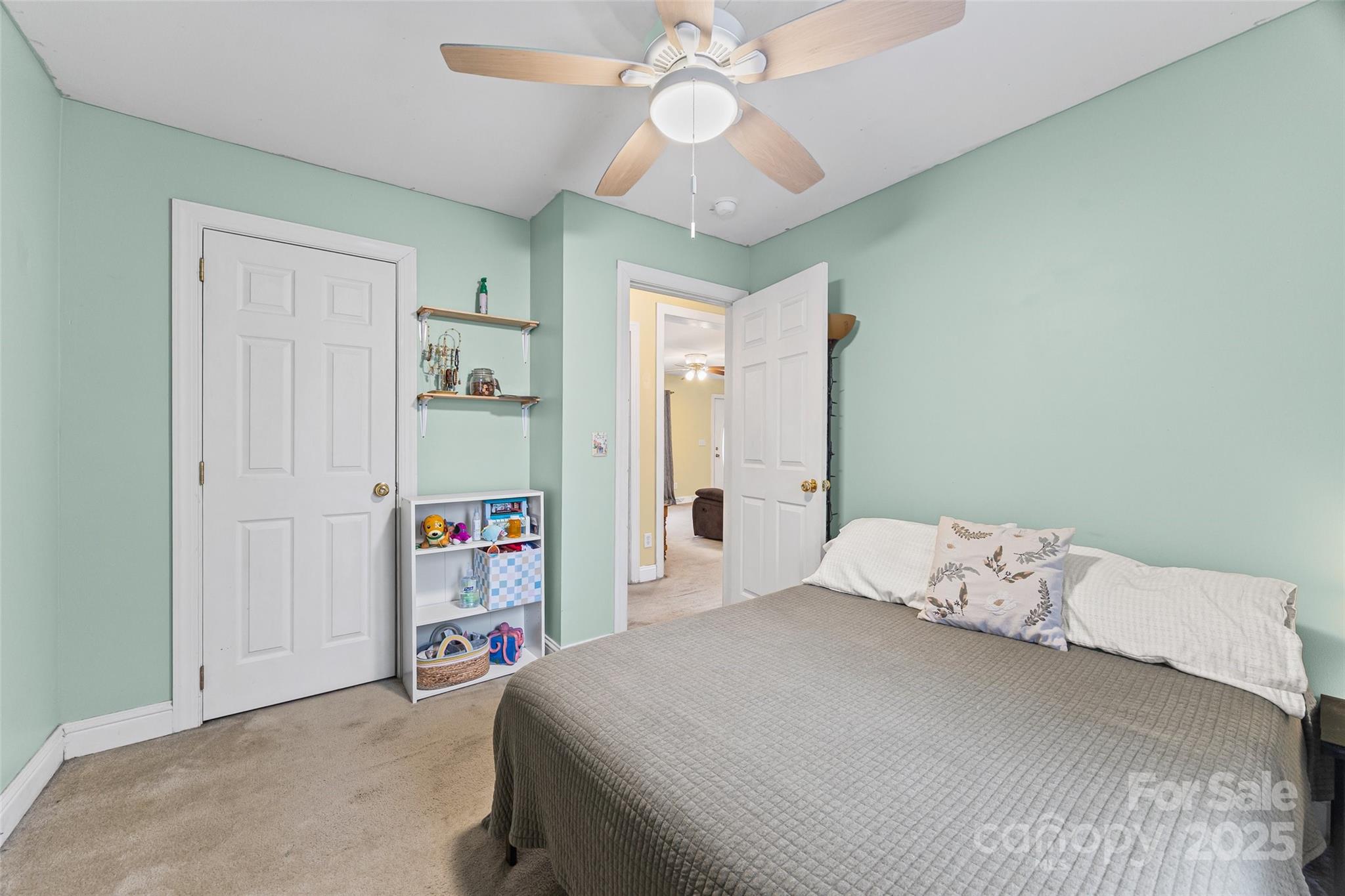 332 Sutton Spring Road York, SC 29745 - Photo 16 of 21 a bedroom with a bed and a book shelf