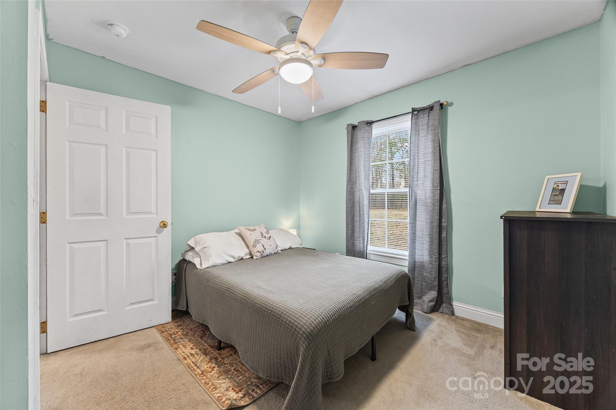 332 Sutton Spring Road York, SC 29745 - Photo 17 of 21 a bedroom with a bed and a window