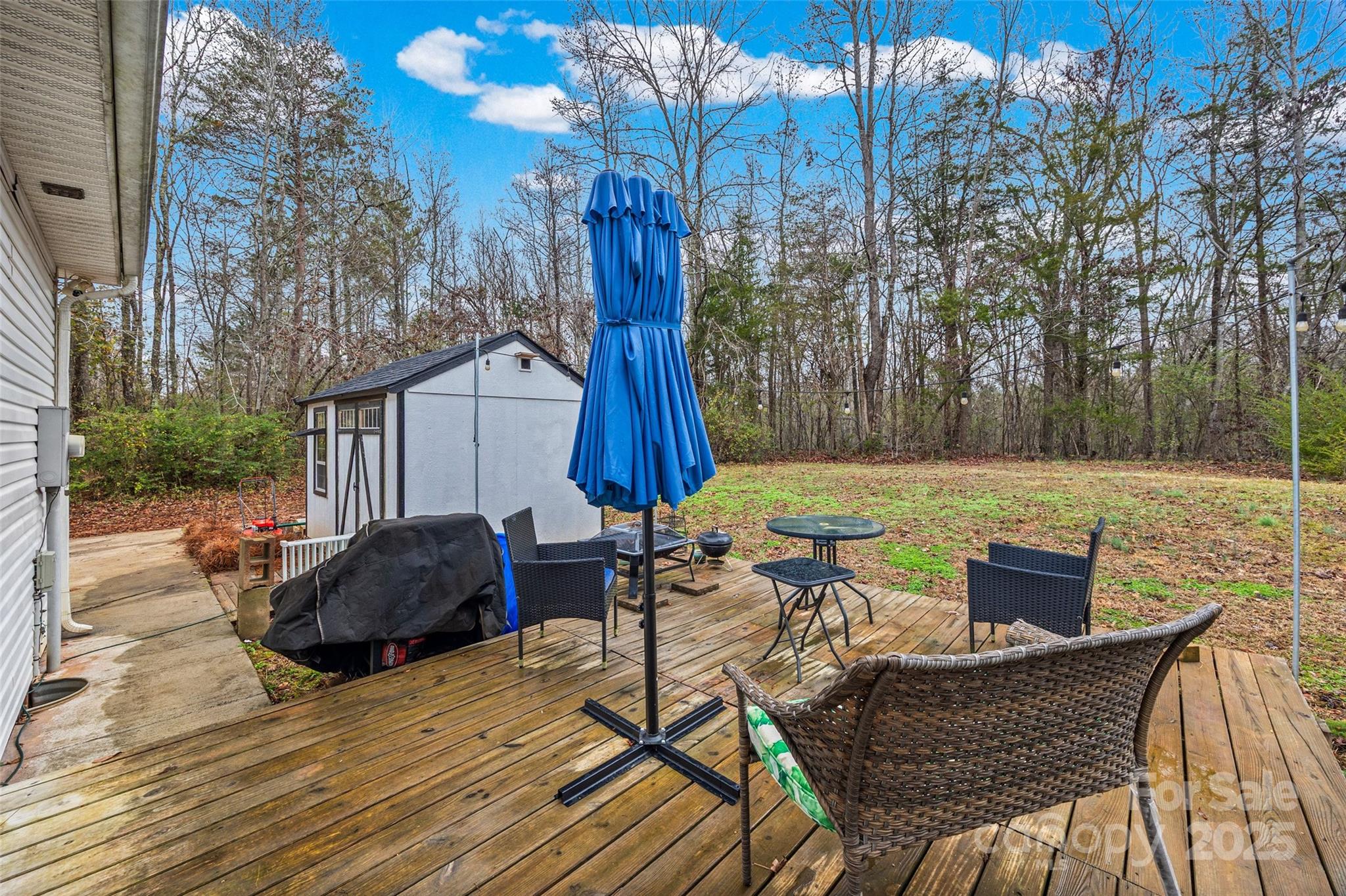 332 Sutton Spring Road York, SC 29745 - Photo 18 of 21 a view of backyard with seating space and trees