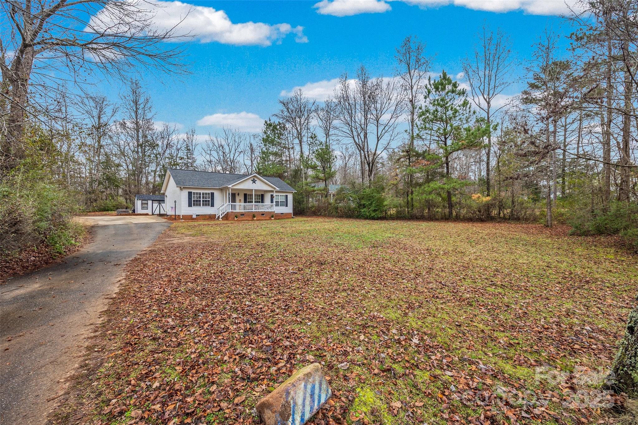 332 Sutton Spring Road York, SC 29745 - Photo 21 of 21 a view of a house with a yard and sitting area