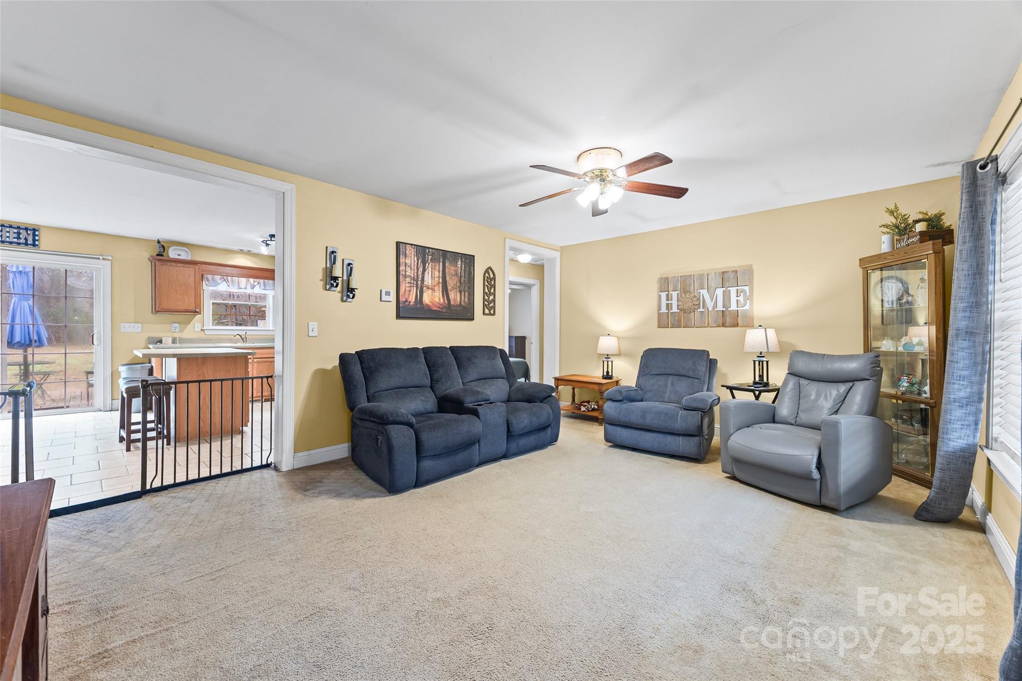 332 Sutton Spring Road York, SC 29745 - Photo 3 of 21 a living room with furniture a ceiling fan a couch and a chandelier