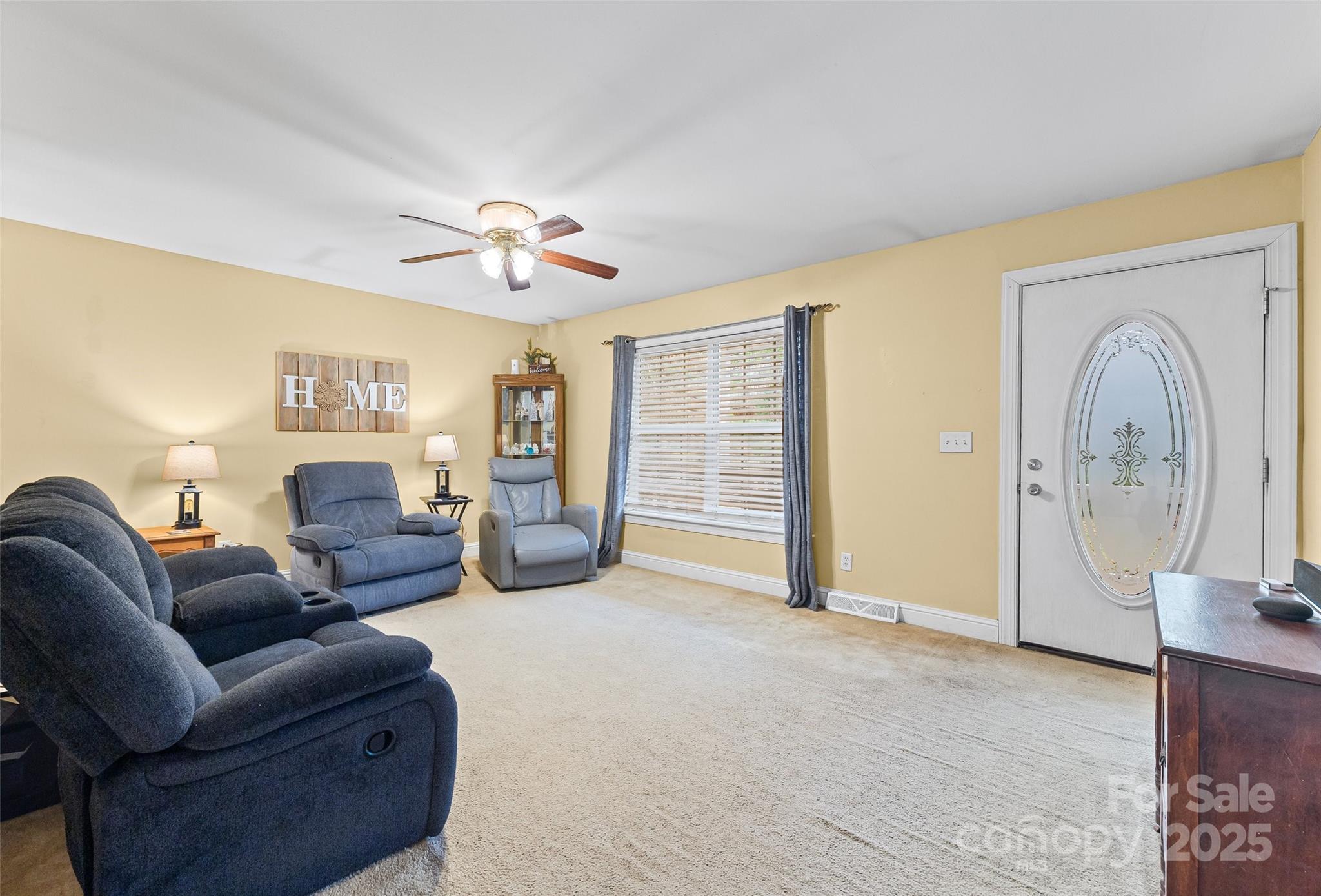 332 Sutton Spring Road York, SC 29745 - Photo 4 of 21 a living room with furniture a ceiling fan and a window