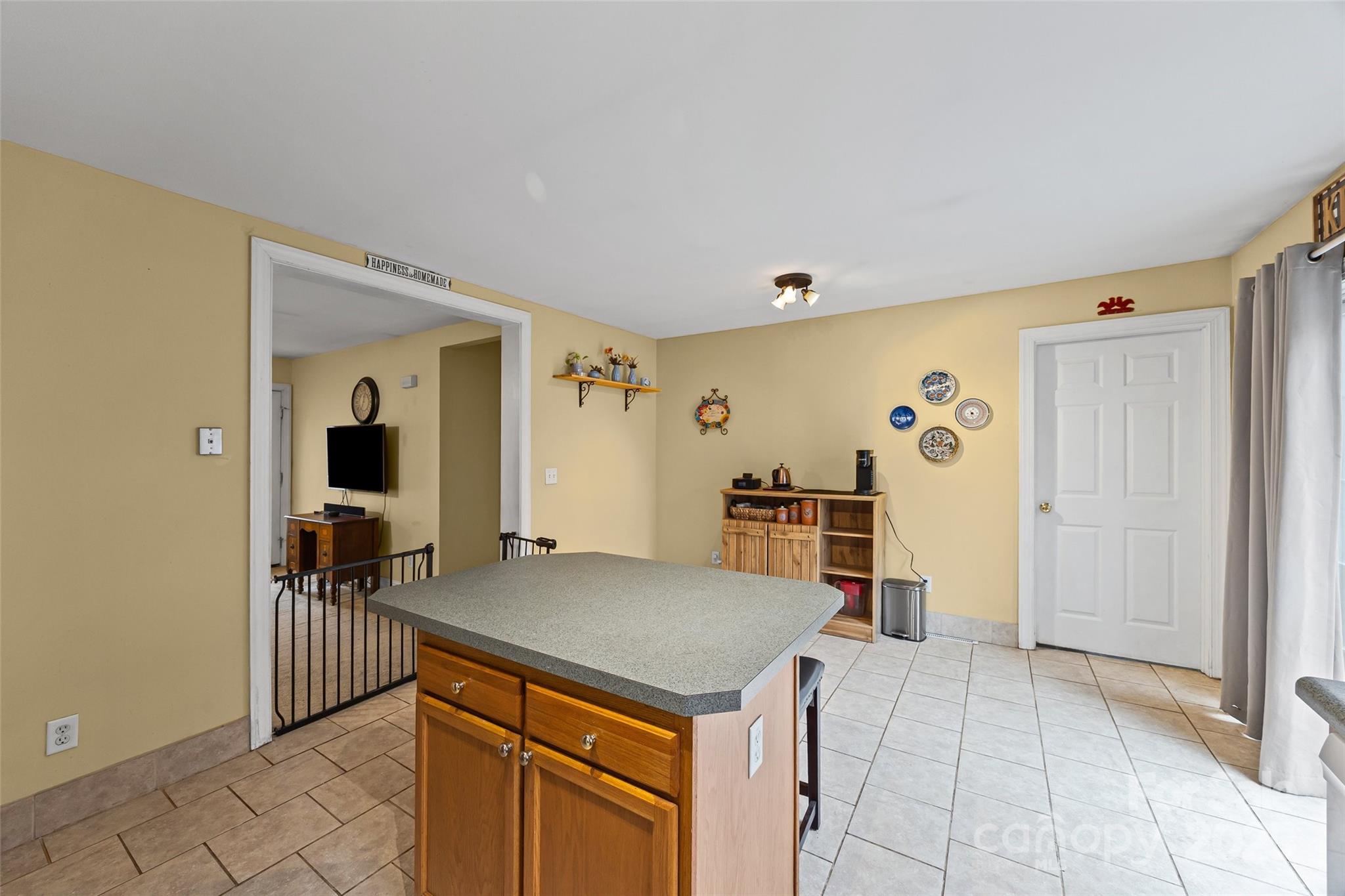 332 Sutton Spring Road York, SC 29745 - Photo 8 of 21 a view of a kitchen with fridge and workspace