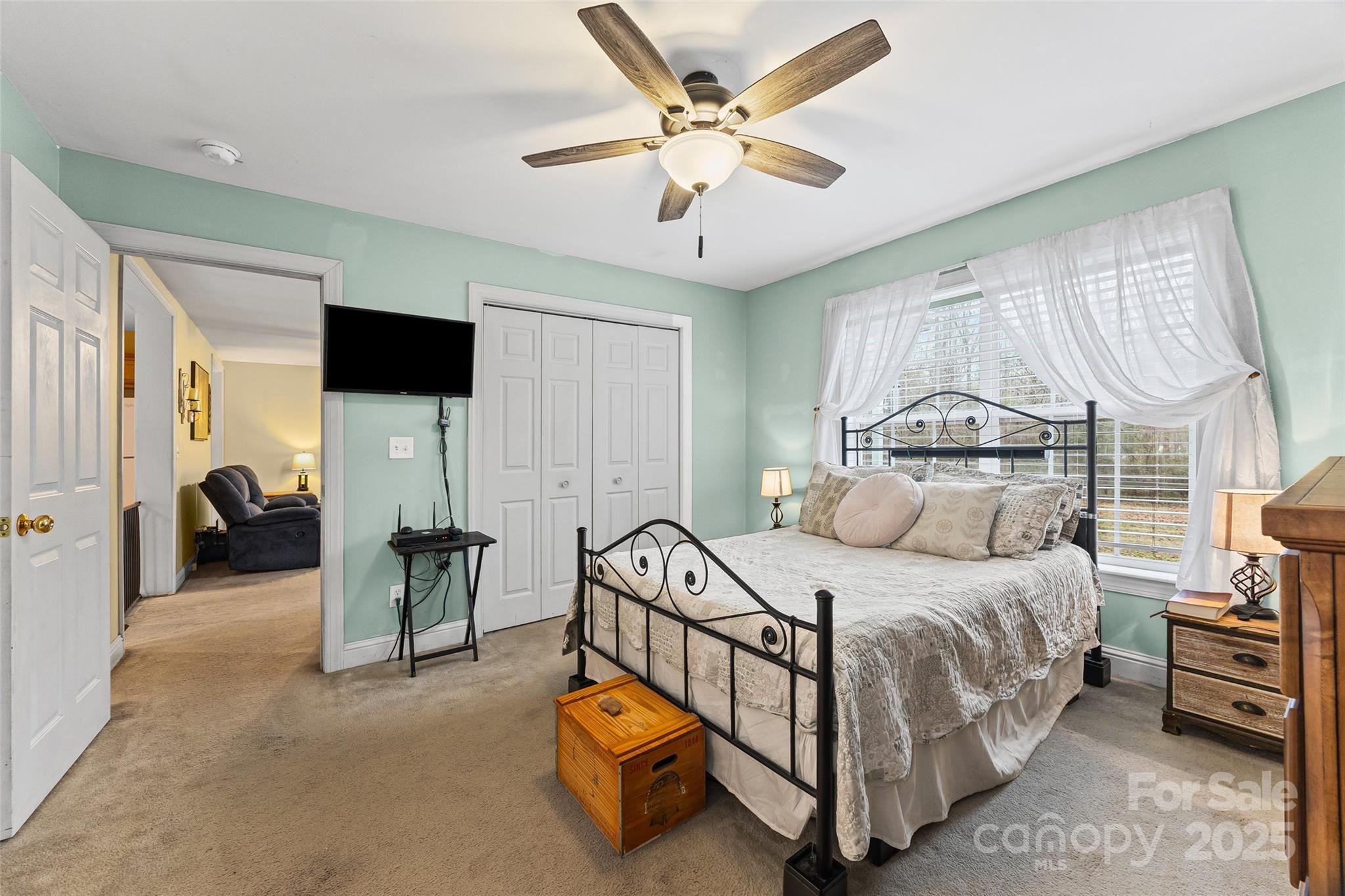 332 Sutton Spring Road York, SC 29745 - Photo 10 of 21 a bedroom with a bed and a chandelier