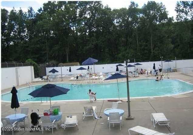 1000 Clove Road, Unit 4P Staten Island, NY 10301 - Photo 21 of 25 a view of table and chairs under an umbrella