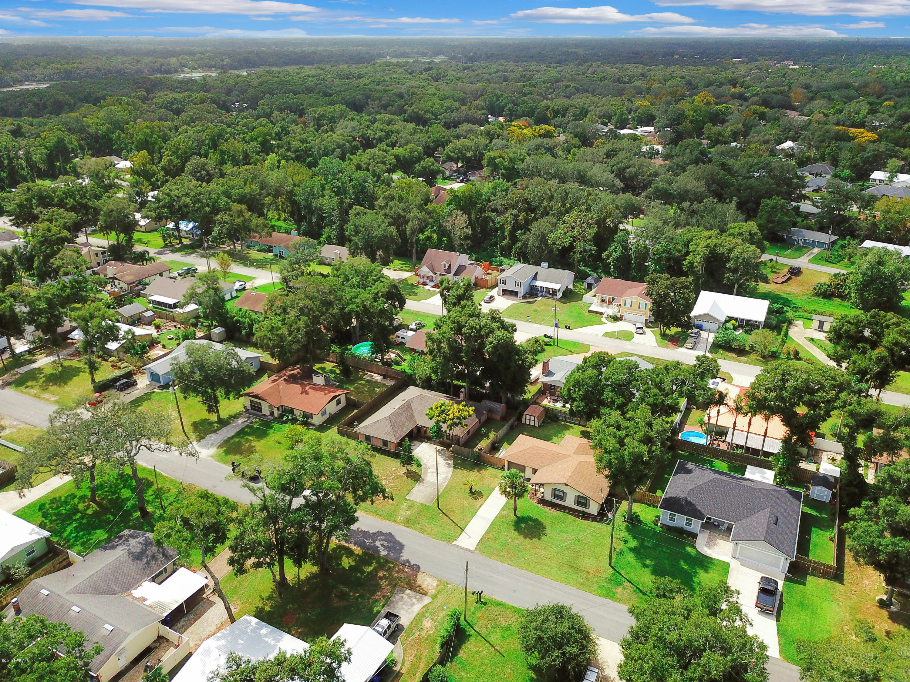 220 Hawthorne Road St. Augustine, FL 32086 - Photo 28 of 36 an aerial view of residential houses with outdoor space and trees