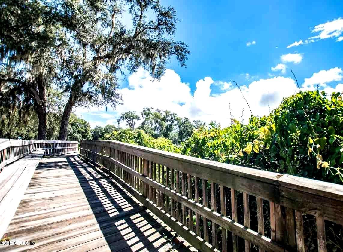 220 Hawthorne Road St. Augustine, FL 32086 - Photo 31 of 36 a view of balcony with wooden floor and fence