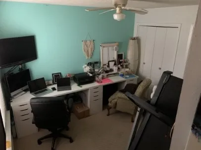 a view of a workspace with furniture