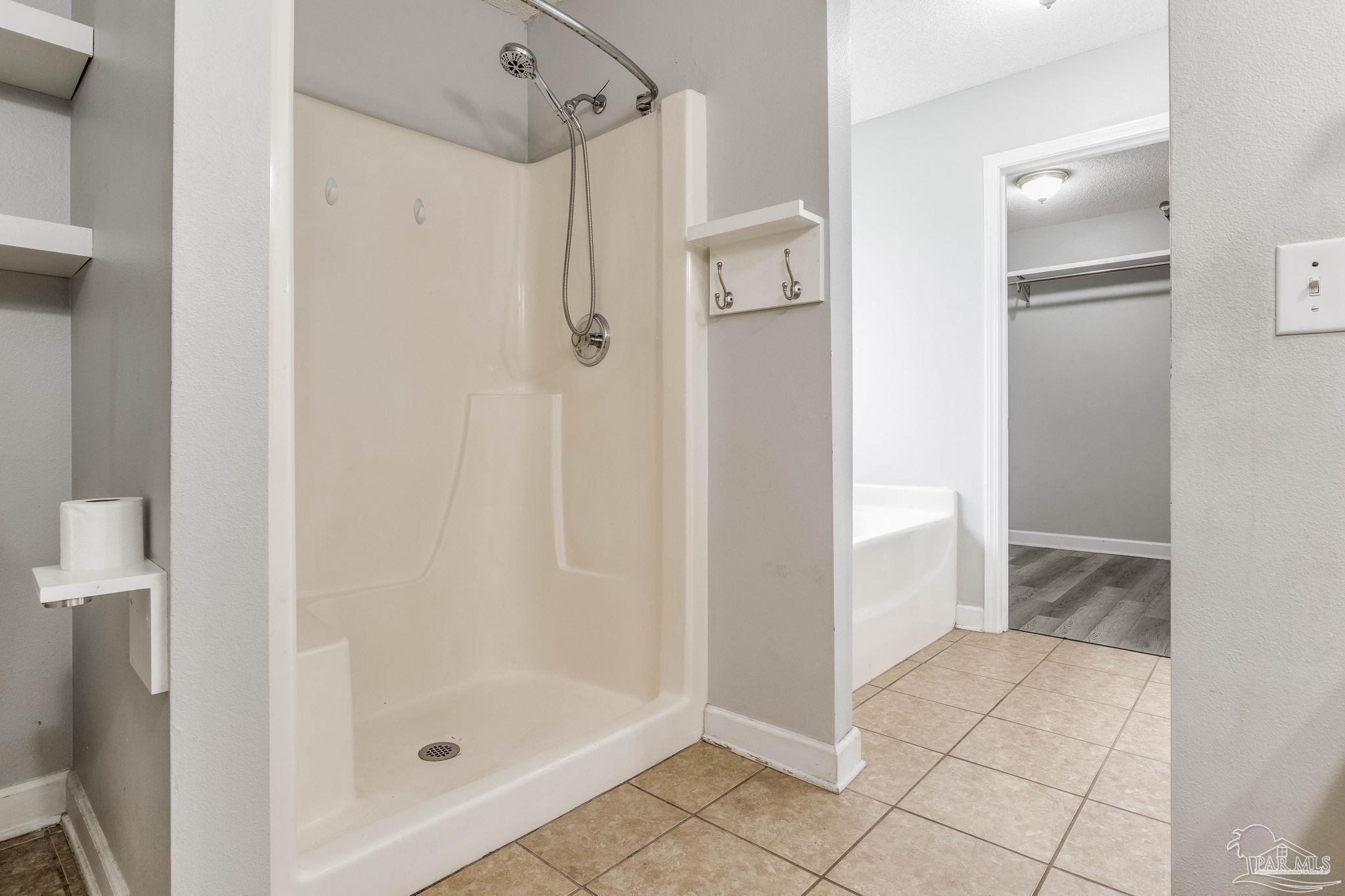 1068 Joaquin Road Pensacola, FL 32506 - Photo 16 of 23 a bathroom with a shower and toilet