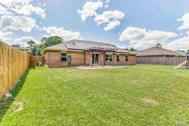 a view of a house with a yard porch and sitting area